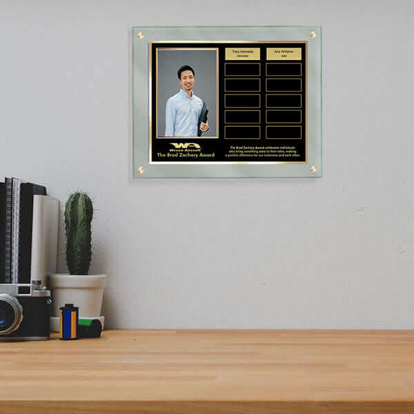 Jade TransLucite perpetual plaque with black header and gold trim, vertical 4x6 photo frame, and 12 brushed gold imprint plates mounted with chrome stand-offs