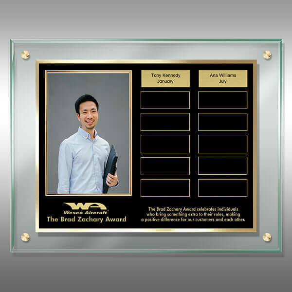 Elegant acrylic award plaque with gold-accented black plate, side photo slot, and dual columns of gold recognition plates on jade-toned acrylic