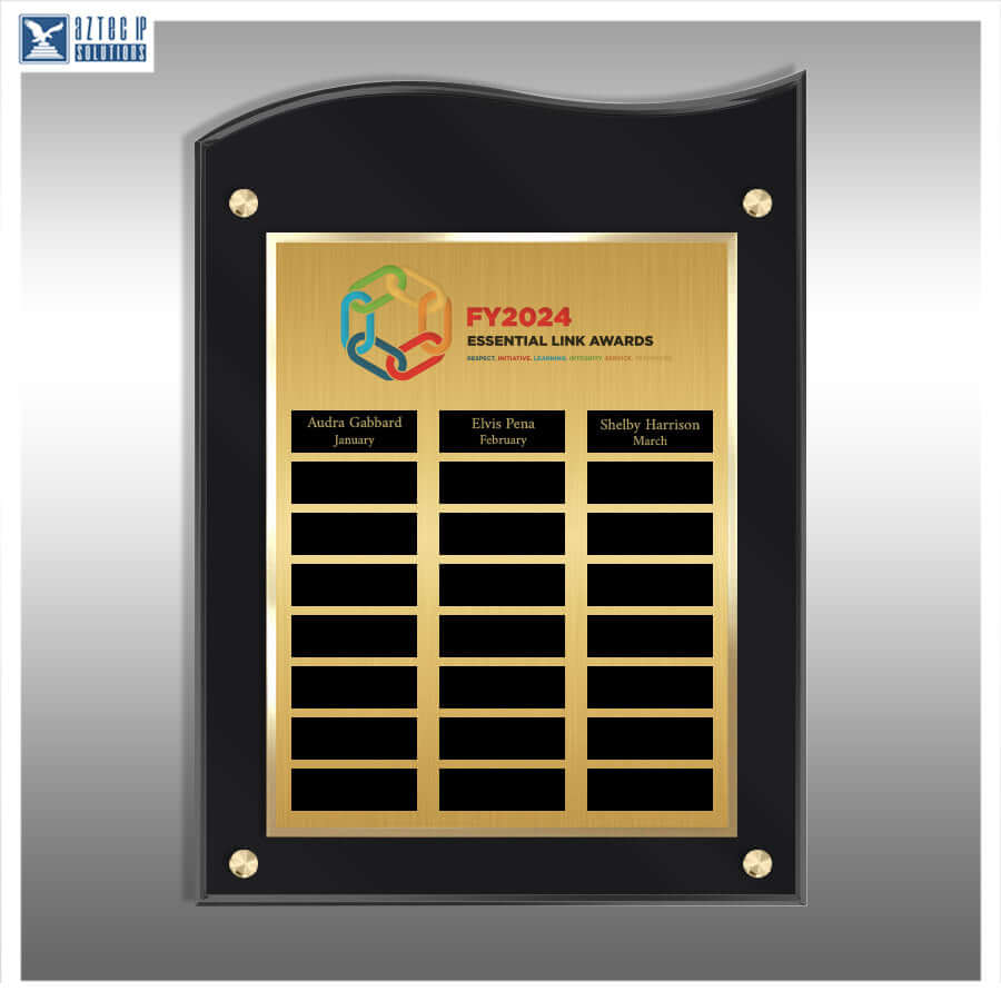 A custom black acrylic award plaque with a brushed gold central panel, mounted on a gray gradient background. The plaque features a black arched frame with gold corner screws and a gold center section containing black nameplates for award recipients.