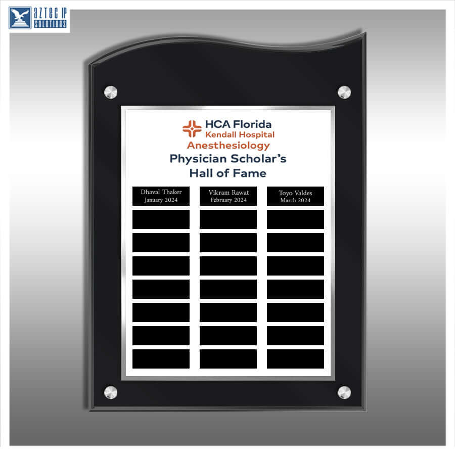 A black acrylic wall plaque with rounded top corners and four silver screws, featuring a white insert with the HCA Florida Kendall Hospital Anesthesiology Physician Scholar's Hall of Fame text and three black nameplates at the bottom, shown on a gray gradient background.